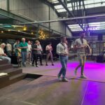 Teilnehmer:innen beim RUDEL.-Community-Event im Austausch – Workshop-Atmosphäre mit Vernetzung und Gesprächen